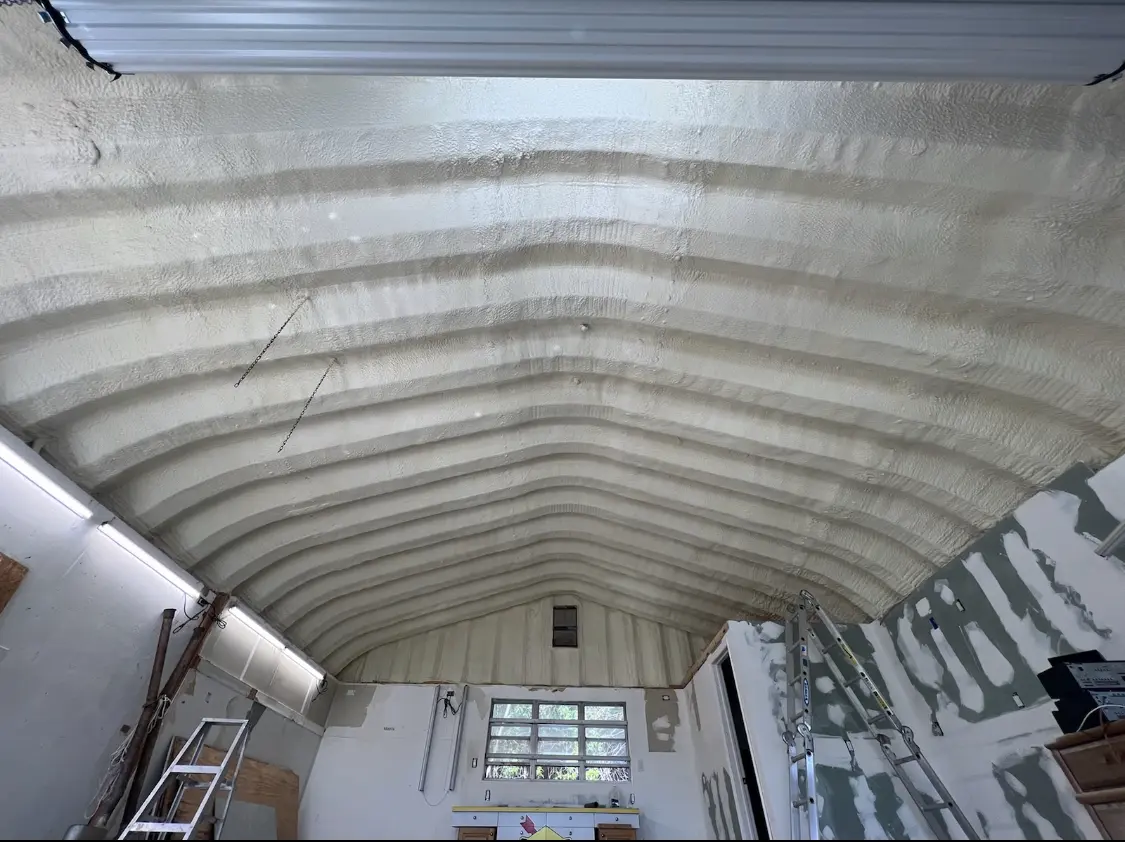 Spray polyurethane foam applied to the underside of a metal roof deck in Bowie